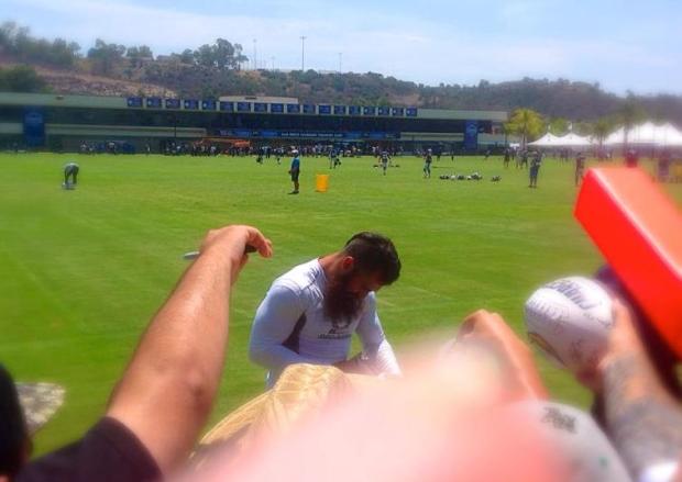 Eric Weddle signing autographs for the fans. Mandatory Photo Credit: David Frerker