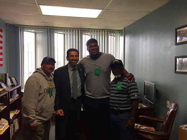 In this photo you have Chargers OT DJ Fluker, Chargers outreach team and the head of San Diego San Diego County's Juvenile Hall. 
