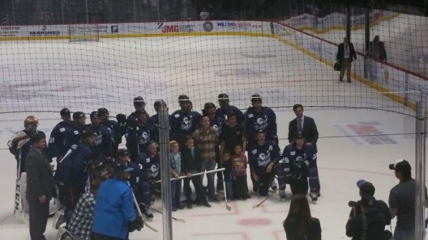 Post game picture with several military officers